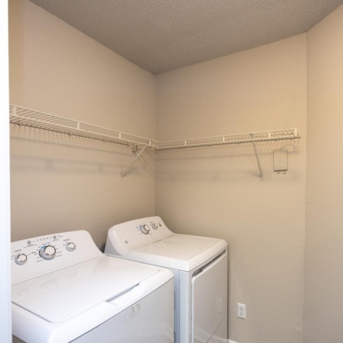 a laundry room with a washer and dryer